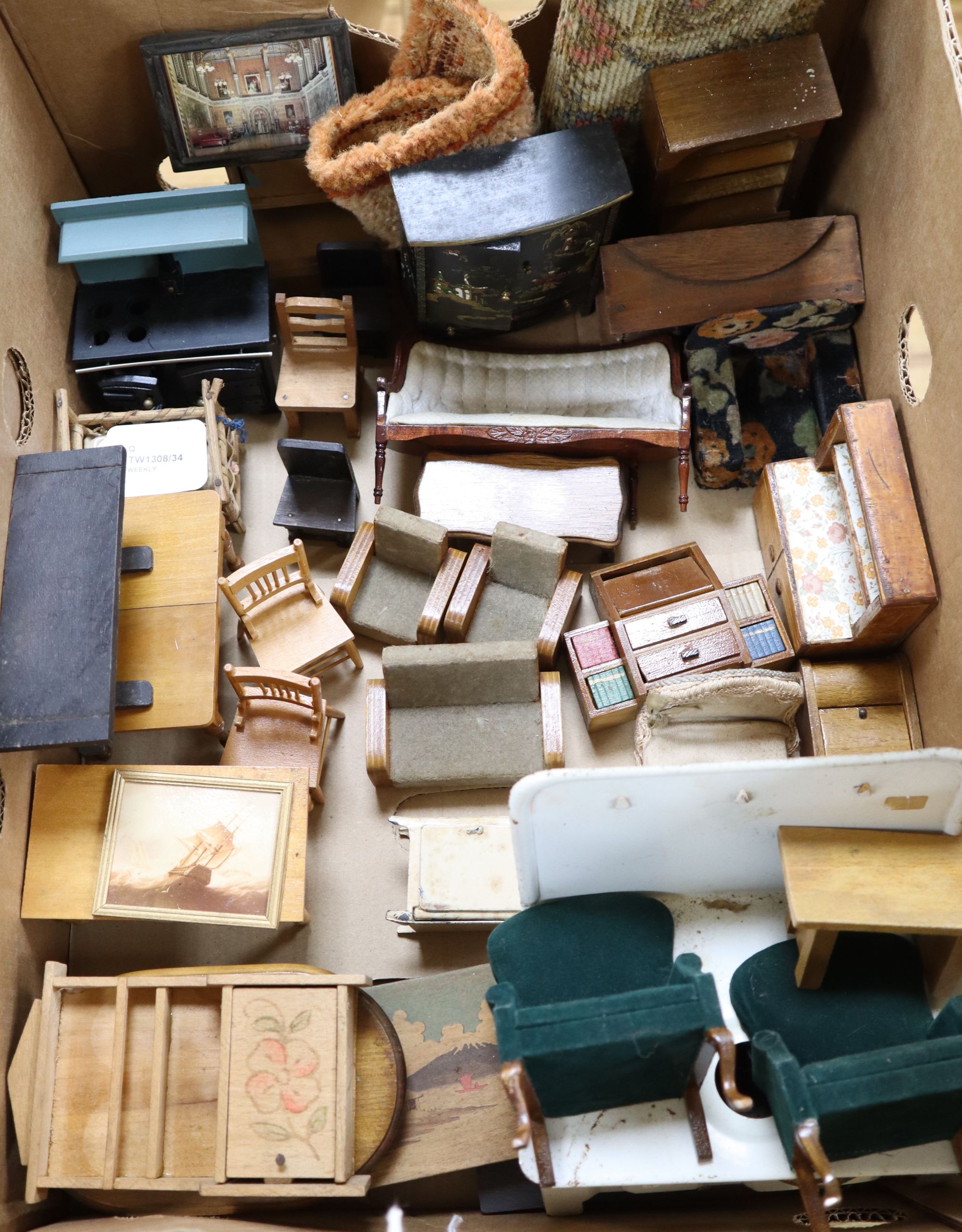 A collection of dolls and dolls house furniture displayed in room settings in a pine cupboard, width 84cm, depth 36cm, height 132cm